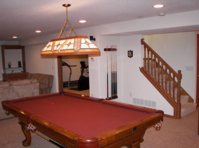Basement man cave with pool table and gym