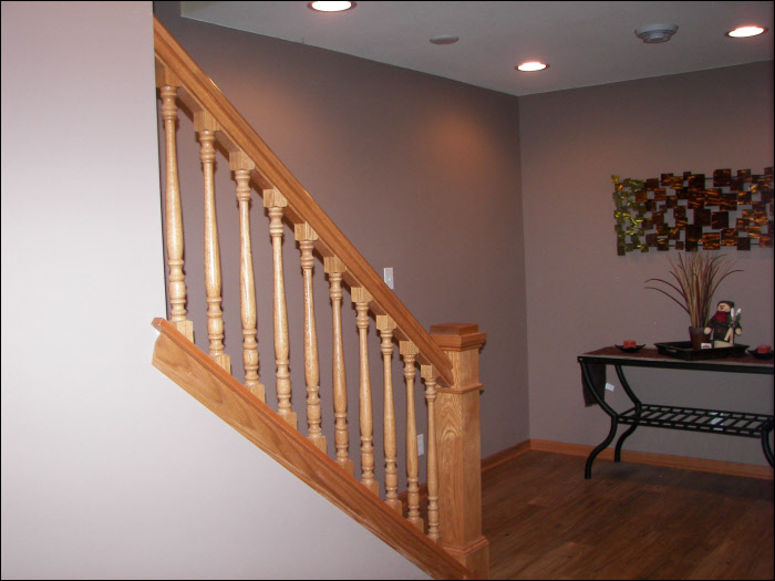 Basement staircase with maple wood