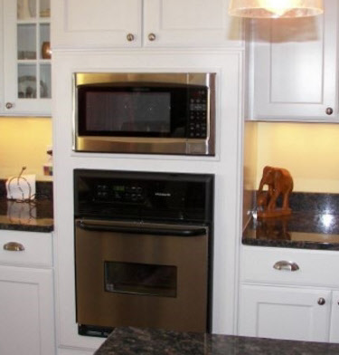 Tall cabinet with oven and microwave cut-out
