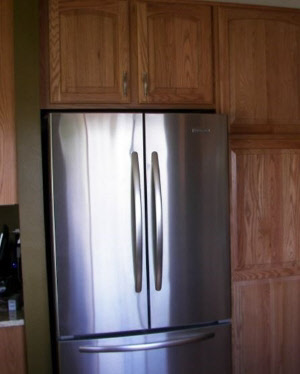 Wall cabinet with refrigerator cut-out