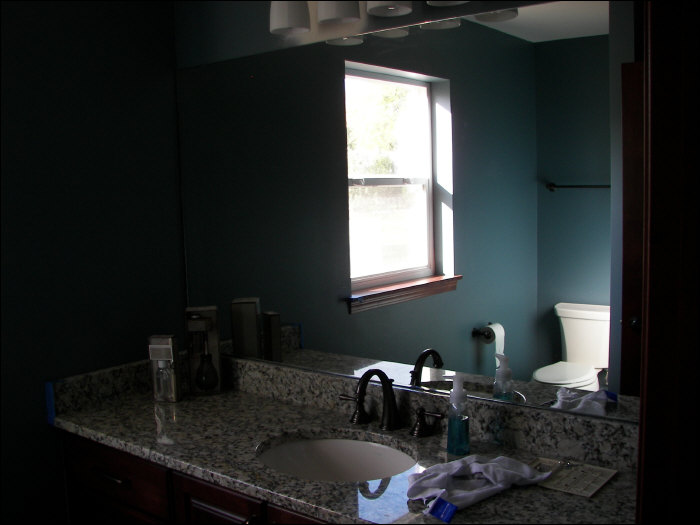 Newly remodeled bathroom with maple vanity and granite countertop