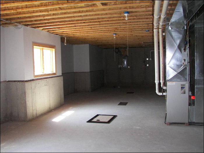 before basement remodel with fireplace