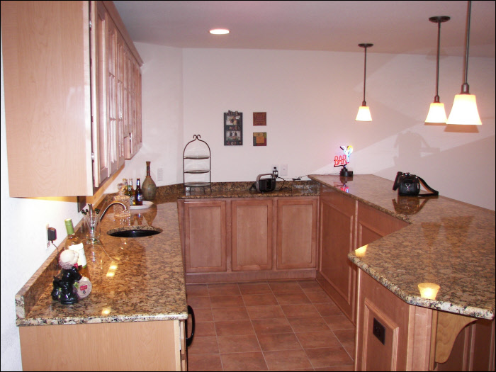 Maple bar with custom cabinetry basement construction