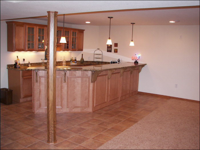 Basement wet bar with ktichen cabinets 