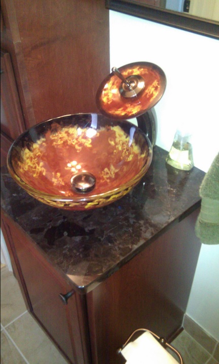 Compact and stylish half bath remodel with innovative lighting fixtures